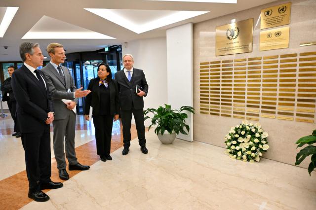 US Secretary of State Antony Blinken (L) listens to deputy Executive director of the World Food Programme (WFP) Carl Skau (2ndL) as he visits a memorial at the World Food Program on the sidelines of the G7 foreign ministers, in Rome on November 25, 2024. G7 foreign ministers meet today near Rome for two days of talks, gathering regional counterparts for talks on the Middle East before turning to Russia and the war in Ukraine. (Photo by Andreas SOLARO / POOL / AFP)