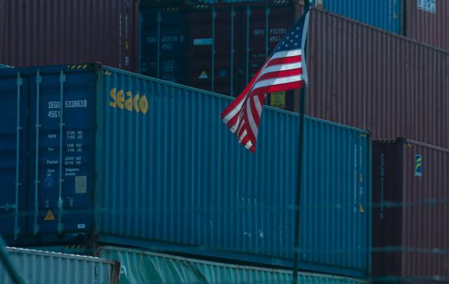 (FILES) Shipping containers are stored at the Port Newark Container Terminal in Newark, New Jersey, on July 21, 2022. US President-elect Donald Trump said November 25, 2024 he intends to impose sweeping tariffs on goods from Mexico, Canada and China, prompting a swift warning from Beijing that "no one will win a trade war." In a series of posts to his Truth Social account, Trump vowed to hit some of the United States' largest trading partners with duties on all goods entering the country. (Photo by Kena Betancur / AFP)