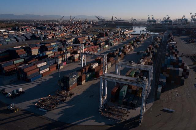 (FILES) An aerial image taken on October 15, 2021 shows cargo shipping containers at the Port of Los Angeles in San Pedro, California. US President-elect Donald Trump said November 25, 2024 he intends to impose sweeping tariffs on goods from Mexico, Canada and China, prompting a swift warning from Beijing that "no one will win a trade war." In a series of posts to his Truth Social account, Trump vowed to hit some of the United States' largest trading partners with duties on all goods entering the country. (Photo by Patrick T. FALLON / AFP)