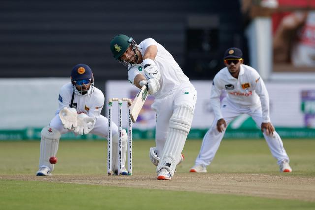 South Africa's Aiden Markram (C) plays a shot during the second day of the first Test cricket match between South Africa and Sri Lanka at the Kingsmead stadium in Durban on November 28, 2024. (Photo by Phill Magakoe / AFP)