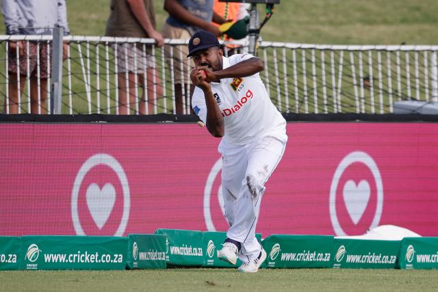 Sri Lanka's Asitha Fernando catches a ball dismissing South Africa's Tony de Zorzi (not seen) during the second day of the first Test cricket match between South Africa and Sri Lanka at the Kingsmead stadium in Durban on November 28, 2024. (Photo by Phill Magakoe / AFP)