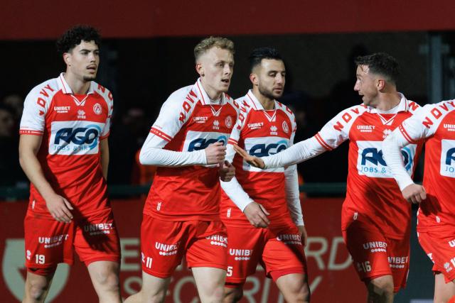 Kortrijk's Belgian defender #11 Dion De Neve (2L) celebrates scoring his team's first goal during the Belgian Pro League football match between KV Kortrijk and KV Mechelen, at the Guldensporen Stadion in Kortrijk on November 29, 2024. (Photo by KURT DESPLENTER / Belga / AFP) / Belgium OUT