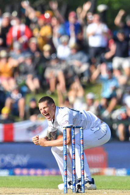 England's Brydon Carse celebrates after dismissing New Zealand's Glenn Phillips during the third day of the first Test cricket match between New Zealand and England at Hagley Oval in Christchurch on November 30, 2024. (Photo by Sanka Vidanagama / AFP)