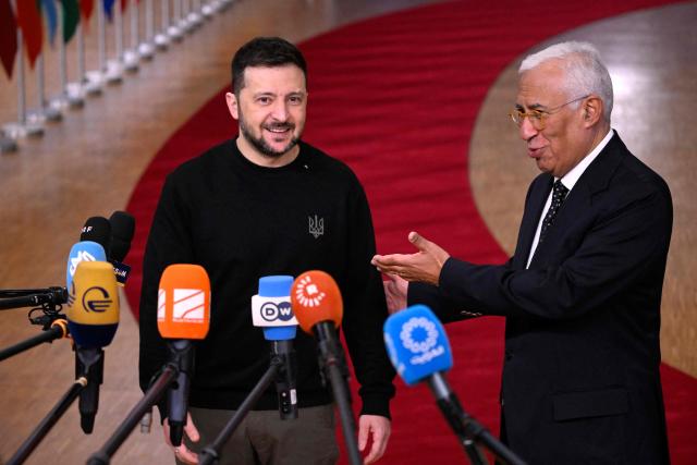 European Council President Antonio Costa (R) gestures next to Ukraine's President Volodymyr Zelensky (L) as they speak to the press prior to the European Council meeting at the EU headquarters in Brussels on December 19, 2024. Ukrainian President Volodymyr Zelensky said December 19, 2024, that only unity between Europe and the United States once Donald Trump takes power could "achieve peace" in Russia's war. (Photo by JOHN THYS / AFP)