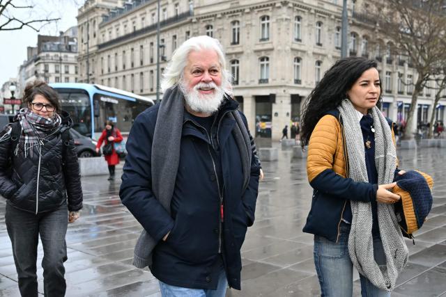 Sea Shepherd Conservation Society founder, anti-whaling activist Paul Watson (C), and Sea Shepherd France President Lamya Essemlali (R) attend a rally in support of Watson a day after he arrived in France following five months in detention in Greenland, at Place de la Republique in Paris, on December 21, 2024. The founder of the Sea Shepherd organisation Paul Watson was released from detention on December 17, 2024, after Denmark refused a Japanese extradition request over a 2010 clash with whalers. (Photo by LOU BENOIST / AFP)