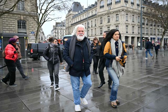 Sea Shepherd Conservation Society founder, anti-whaling activist Paul Watson (L), and Sea Shepherd France President Lamya Essemlali attend a rally in support of Watson a day after he arrived in France following five months in detention in Greenland, at Place de la Republique in Paris, on December 21, 2024. The founder of the Sea Shepherd organisation Paul Watson was released from detention on December 17, 2024, after Denmark refused a Japanese extradition request over a 2010 clash with whalers. (Photo by LOU BENOIST / AFP)