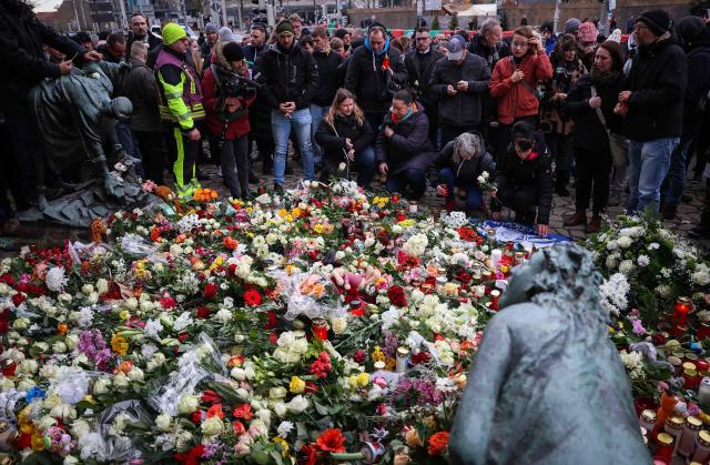 Well wishers lay flowers near the site of a car-ramming attack on a Christmas market in Magdeburg, eastern Germany, on December 21, 2024, resulting in several deaths and dozens of injured. The death toll in the attack on December 20, rose to 5 on December 21, 2024, with over 200 injured, according to the head of the regional government, Reiner Haseloff. (Photo by Ronny HARTMANN / AFP)