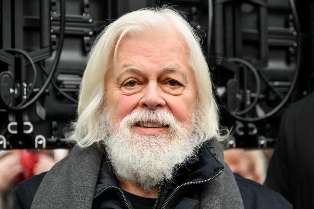 Sea Shepherd Conservation Society founder, anti-whaling activist Paul Watson, attends a rally in his support a day after arriving France following five months in detention in Greenland, at Place de la Republique in Paris, on December 21, 2024. The founder of the Sea Shepherd organisation Paul Watson was released from detention on December 17, 2024, after Denmark refused a Japanese extradition request over a 2010 clash with whalers. (Photo by LOU BENOIST / AFP)