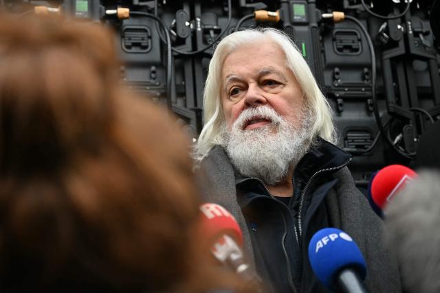 Sea Shepherd Conservation Society founder, anti-whaling activist Paul Watson speaks to the press as he attends a rally in his support a day after arriving France following five months in detention in Greenland, at Place de la Republique in Paris, on December 21, 2024. The founder of the Sea Shepherd organisation Paul Watson was released from detention on December 17, 2024, after Denmark refused a Japanese extradition request over a 2010 clash with whalers. (Photo by LOU BENOIST / AFP)