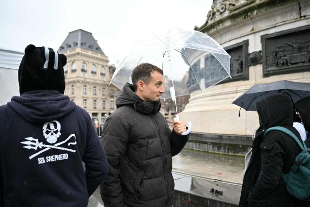 French journalist and writer Hugo Clement  attends a rally in support of Sea Shepherd Conservation Society founder, anti-whaling activist Paul Watson, a day after he arrived in France following five months in detention in Greenland, at Place de la Republique in Paris, on December 21, 2024. The founder of the Sea Shepherd organisation Paul Watson was released from detention on December 17, 2024, after Denmark refused a Japanese extradition request over a 2010 clash with whalers. (Photo by LOU BENOIST / AFP)