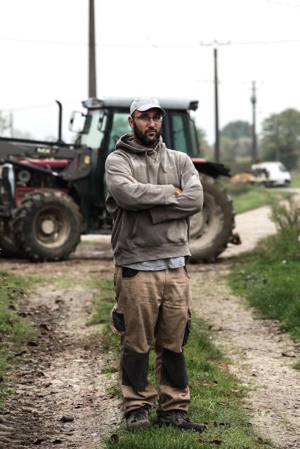 (FILES) Jerome Caze, a 37-year-old farmer who runs a vegetable farm, chicken and pig farm, poses for a photo portrait in Meilhan-sur-Garonne, south-western France on October 3, 2024. Jerome Caze, 37, married with three children, runs a market garden and chicken and pig farm in the Lot-et-Garonne region of France. Since October 2024, he has been telling AFP about his daily life as a “small farmer” in a farming world beset by recurring crises. (Photo by Thibaud MORITZ / AFP)