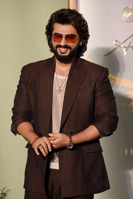 Bollywood actor Arjun Kapoor poses during an exclusive preview night of 'NMACC Arts Cafй’ near the Nita Mukesh Ambani Cultural Centre (NMACC) in Mumbai on December 21, 2024. (Photo by Sujit JAISWAL / AFP)