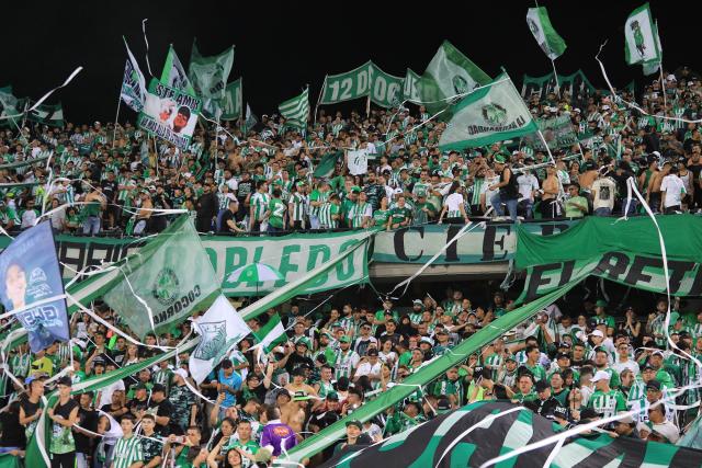 Fans of Nacional cheer for their team during the Colombian League second leg football final match between Atletico Nacional and Deportes Tolima at the Atanasio Girardot Stadium in Medellin, Colombia on December 22, 2024. (Photo by JAIME SALDARRIAGA / AFP)