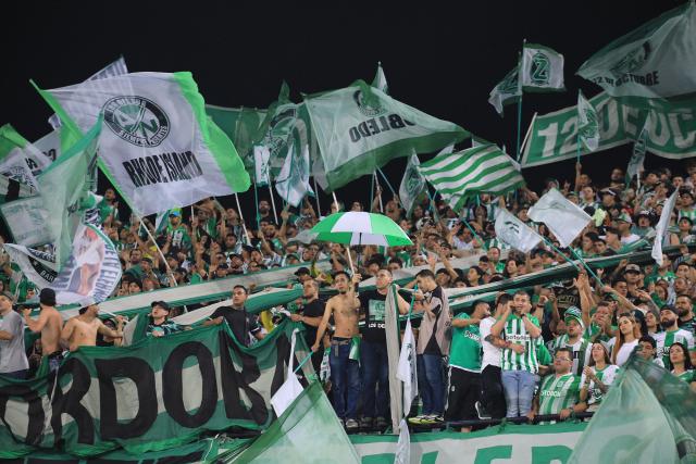 Fans of Nacional cheer for their team during the Colombian League second leg football final match between Atletico Nacional and Deportes Tolima at the Atanasio Girardot Stadium in Medellin, Colombia on December 22, 2024. (Photo by JAIME SALDARRIAGA / AFP)