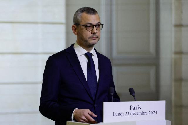 Elysee Palace Secretary-General Alexis Kohler announces the list of newly appointed ministers forming the new French government, at the presidential Elysee Palace in Paris, on December 23, 2024. France's new government was announced on December 23 amid efforts to drag the country out of political crisis. The Elysee announced  the composition of the cabinet of Francois Bayrou, a 73-year-old centrist who was appointed prime minister on December 13 following the fall of a short-lived conservative-led government. (Photo by Abdul Saboor / POOL / AFP)