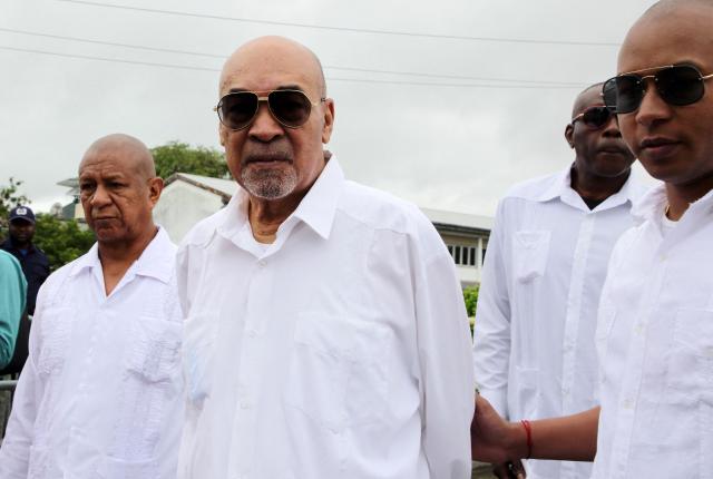 (FILES) Suriname former President Desi Bouterse (C) leaves the High Court of Justice after his appeal case against the Court Martial sentence of 20-year jail for his involvement in the murder of 15 people when he ruled in 1982 during his military government, in Paramaribo on January 5, 2023. Bouterse, the former dictator of Suriname who was a fugitive from justice for the murder of political opponents four decades ago, has died at age 79, the government said on December 25, 2024. (Photo by Ranu Abhelakh / AFP)