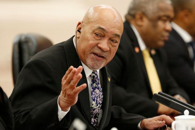 (FILES) Suriname's President Desi Bouterse (L) attends a meeting with China's Premier Li Keqiang (not pictured) at the Great Hall of the People in Beijing on November 27, 2019. Bouterse, the former dictator of Suriname who was a fugitive from justice for the murder of political opponents four decades ago, has died at age 79, the government said on December 25, 2024. (Photo by FLORENCE LO / POOL / AFP)