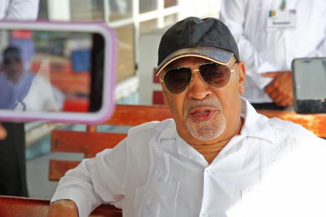 (FILES) Suriname's former President Desi Bouterse speaks to the press outside the High Court of Justice before the start of his appeal case against the Court Martial on Tuesday, May 30, 2023. Bouterse, the former dictator of Suriname who was a fugitive from justice for the murder of political opponents four decades ago, has died at age 79, the government said on December 25, 2024. (Photo by Ranu Abhelakh / AFP)