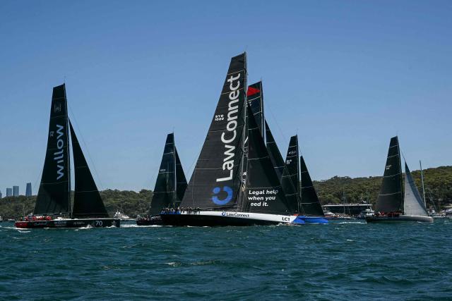 Yachts compete at the start of the Sydney to Hobart yacht race from Sydney Harbour in Sydney on December 26, 2024. (Photo by Saeed KHAN / AFP)