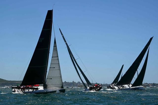 Yachts compete at the start of the Sydney to Hobart yacht race from Sydney Harbour in Sydney on December 26, 2024. (Photo by Saeed KHAN / AFP)