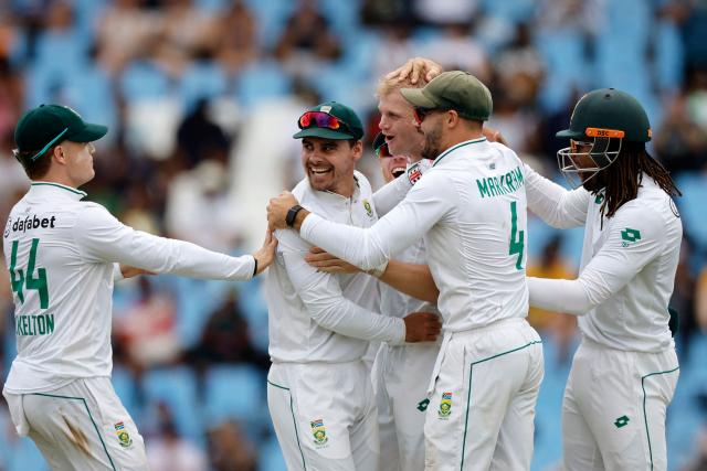 South Africa's Corbin Bosch (3rd L) celebrates with teammates the dismissal of Pakistan's Shan Masood (unseen) during the first day of the first cricket Test match between South Africa and Pakistan at SuperSport Park in Centurion on December 26, 2024. (Photo by PHILL MAGAKOE / AFP)