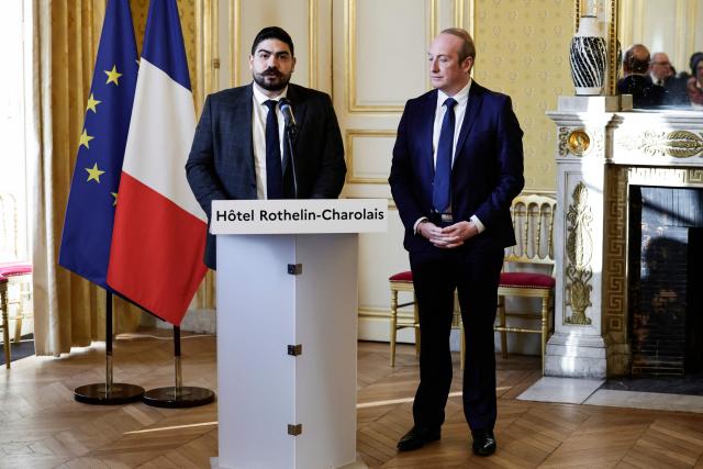 Outgoing French Minister of Civil Service, Streamlining, and Public Sector Transformation Guillaume Kasbarian (L) delivers a speech next to Newly-appointed French Minister of Public Action, Civil Service and Simplification Laurent Marcangeli during a handover ceremony, at the hotel Rothelin-Charolais in Paris, on December 26, 2024. (Photo by STEPHANE DE SAKUTIN / AFP)