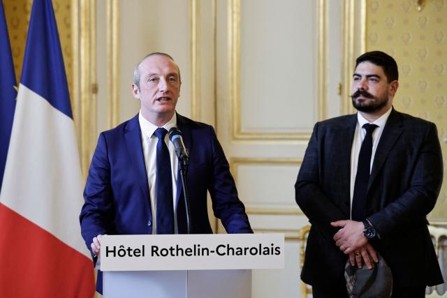 Newly-appointed French Minister of Public Action, Civil Service and Simplification Laurent Marcangeli (L) delivers a speech next to outgoing French Minister of Civil Service, Streamlining, and Public Sector Transformation Guillaume Kasbarian during a handover ceremony, in Paris, on December 26, 2024. (Photo by STEPHANE DE SAKUTIN / AFP)