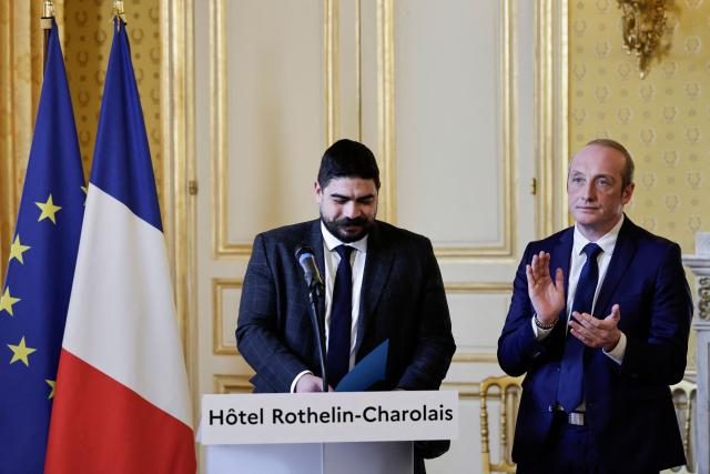 Outgoing French Minister of Civil Service, Streamlining, and Public Sector Transformation Guillaume Kasbarian (L) delivers a speech next to Newly-appointed French Minister of Public Action, Civil Service and Simplification Laurent Marcangeli during a handover ceremony, at the hotel Rothelin-Charolais in Paris, on December 26, 2024. (Photo by STEPHANE DE SAKUTIN / AFP)