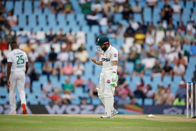 Pakistan's Mohammad Rizwan reacts after a ball hit his right hand during a delivery during the first day of the first cricket Test match between South Africa and Pakistan at SuperSport Park in Centurion on December 26, 2024. (Photo by PHILL MAGAKOE / AFP)