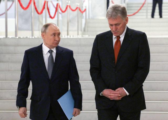 In this pool photograph distributed by the Russian state agency Sputnik, Russia's President Vladimir Putin and Kremlin spokesman Dmitry Peskov are seen before a meeting of the Supreme Eurasian Economic Council at Igora ski resort in the Leningrad region on December 26, 2024. (Photo by Gavriil Grigorov / POOL / AFP)