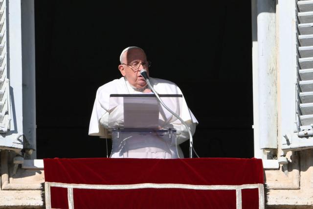 Pope Francis addresses the crowd from the window of the apostolic palace overlooking St. Peter's square during the Angelus prayer on December 26, 2024 in The Vatican. (Photo by Alberto PIZZOLI / AFP)