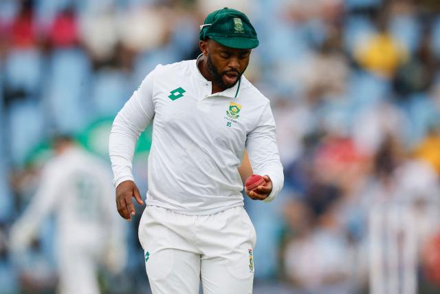 South Africa's Temba Bavuma cleans the ball during the first day of the first cricket Test match between South Africa and Pakistan at SuperSport Park in Centurion on December 26, 2024. (Photo by PHILL MAGAKOE / AFP)