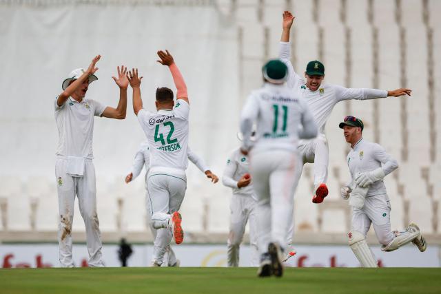 South Africa's Dane Paterson (2nd L) celebrates with teammates after the dismissal of Pakistan's Mohammad Rizwan (unseen) during the first day of the first cricket Test match between South Africa and Pakistan at SuperSport Park in Centurion on December 26, 2024. (Photo by PHILL MAGAKOE / AFP)