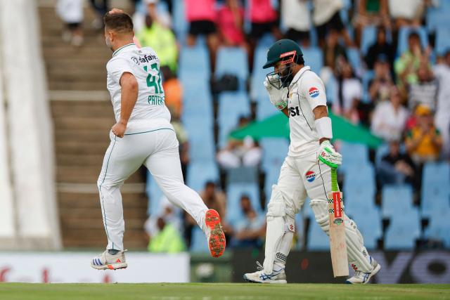 South Africa's Dane Paterson (L) celebrates after the dismissal of Pakistan's Mohammad Rizwan (R) during the first day of the first cricket Test match between South Africa and Pakistan at SuperSport Park in Centurion on December 26, 2024. (Photo by PHILL MAGAKOE / AFP)