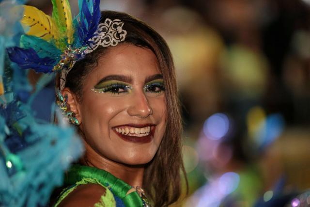 A salsa dancer poses for a picture during a parade in the framework of the Fair of Cali at the Salsodromo in Cali, Colombia, on December 25, 2024. (Photo by Lusef ROJAS / AFP)