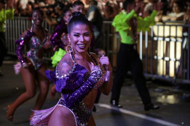 A salsa dancer performs during a parade in the framework of the Fair of Cali at the Salsodromo in Cali, Colombia, on December 25, 2024. (Photo by Lusef ROJAS / AFP)