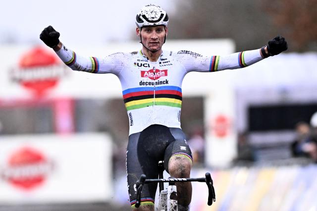 Dutch Mathieu Van Der Poel celebrates as he crosses the finish line to win the stage 7 (out of 12) of the men's UCI Cyclocross World Cup elite race in Gavere, northern Belgium, on December 26, 2024. (Photo by JASPER JACOBS / Belga / AFP) / Belgium OUT