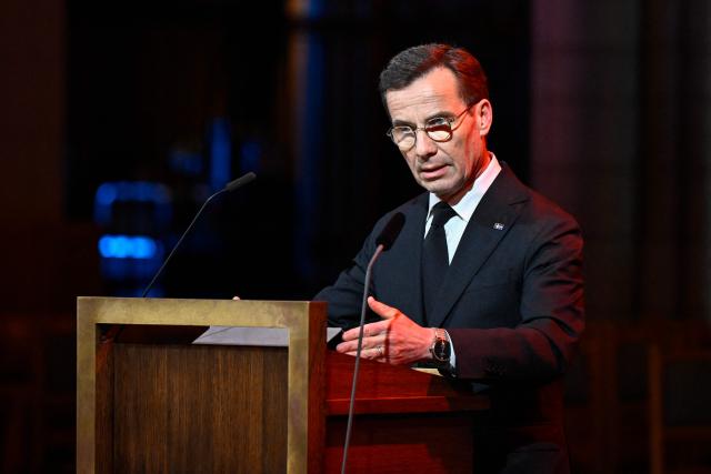 Sweden's Prime Minister Ulf Kristersson gives a speech during a memorial service for the victims of the 2004 tsunami in the Indian Ocean, at the Cathedral in Uppsala, on December 26, 2024. (Photo by Christine OLSSON / TT News Agency / AFP) / Sweden OUT