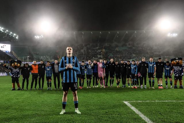 Club's Belgian defender #41 Hugo Siquet (C) celebrates with teammates at the end of the Belgian Pro League first division football match between Club Brugge KV and KVC Westerlo, in Bruges, on December 26, 2024. (Photo by BRUNO FAHY / Belga / AFP) / Belgium OUT