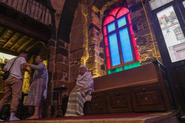 Customers rest after washing up, in the cool section of the Al-Malik Al-Zahir Hammam, one of the oldest public bathhouses in Damascus on December 26, 2024. Built in the second half of the tenth century during the Fatimid period, the establishment was renamed later by the Mamluk ruler Al-Saeed Nasser Al-Din who bought the bath and an adjacent house and named it after his father Mamluk sultan Al-Zahir Baybars. (Photo by ANWAR AMRO / AFP)