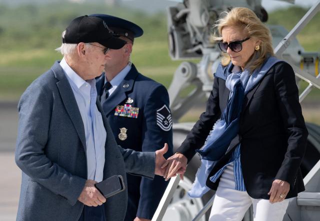 US President Joe Biden and First Lady Jill Biden disembark from Air Force One upon arrival at Henry E. Rohlsen Airport in Christiansted, St. Croix, on the US Virgin Islands, on December 26, 2024, as they arrive or a week-long visit. (Photo by SAUL LOEB / AFP)