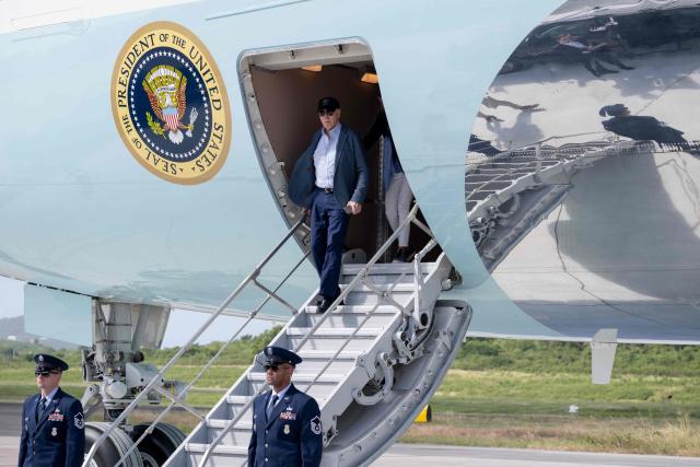 US President Joe Biden disembarks from Air Force One upon arrival at Henry E. Rohlsen Airport in Christiansted, St. Croix, on the US Virgin Islands, on December 26, 2024, as he arrives for a week-long visit. (Photo by SAUL LOEB / AFP)