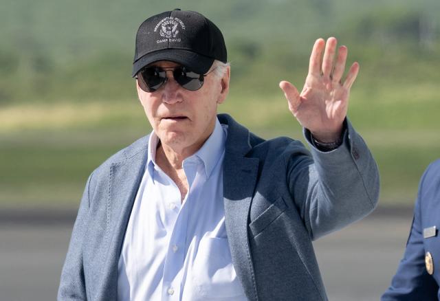 US President Joe Biden waves as he disembarks from Air Force One upon arrival at Henry E. Rohlsen Airport in Christiansted, St. Croix, on the US Virgin Islands, on December 26, 2024, as he arrives for a week-long visit. (Photo by SAUL LOEB / AFP)