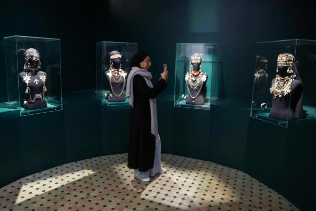 A visitor takes pictures of jewellery displayed at the National Jewellery Museum, a part of UNESCO's World Heritage sites, together with the medieval Kasbah of the Udayas, in Morocco's capital Rabat, on December 26, 2024. (Photo by AFP)