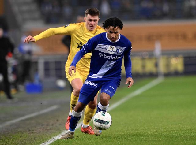 Gent's Swedish Momodou Lamin Sonko (R) fights for the ball with Gent's British forward #21 Max Dean during a Belgian Pro League football match between KAA Gent and Royale Union SG at the Planet Group Arena in Ghent on December 26, 2024. (Photo by JOHN THYS / Belga / AFP) / Belgium OUT