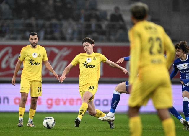 Union's Belgian defender #48 Fedde Leysen runs with the ball during a Belgian Pro League football match between KAA Gent and Royale Union SG at the Planet Group Arena in Ghent on December 26, 2024. (Photo by JOHN THYS / Belga / AFP) / Belgium OUT