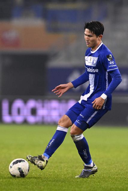 Gent's Japanese defender #04 Tsuyoshi Watanabe runs with the ball during a Belgian Pro League football match between KAA Gent and Royale Union SG at the Planet Group Arena in Ghent on December 26, 2024. (Photo by JOHN THYS / Belga / AFP) / Belgium OUT