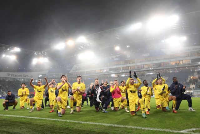 Union's players celebrate after winning the Belgian Pro League football match between KAA Gent and Royale Union SG at the Planet Group Arena in Ghent on December 26, 2024. (Photo by VIRGINIE LEFOUR / Belga / AFP) / Belgium OUT