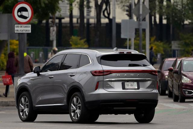 A Chinese-made Haval H6 SUV is seen on Reforma Avenue in Mexico City on December 23, 2024. Sales of luxury vehicles in Mexico registered a significant drop in 2024, in the face of a stronger presence of Chinese-made vehicles preferred by consumers.  (Photo by ALFREDO ESTRELLA / AFP)