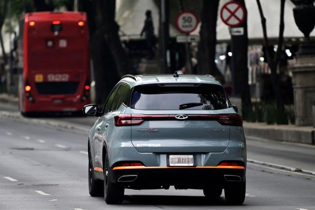 A Chinese-made Chery Tiggo 7 Pro SUV is seen on Reforma Avenue in Mexico City on December 23, 2024. Sales of luxury vehicles in Mexico registered a significant drop in 2024, in the face of a stronger presence of Chinese-made vehicles preferred by consumers.  (Photo by ALFREDO ESTRELLA / AFP)